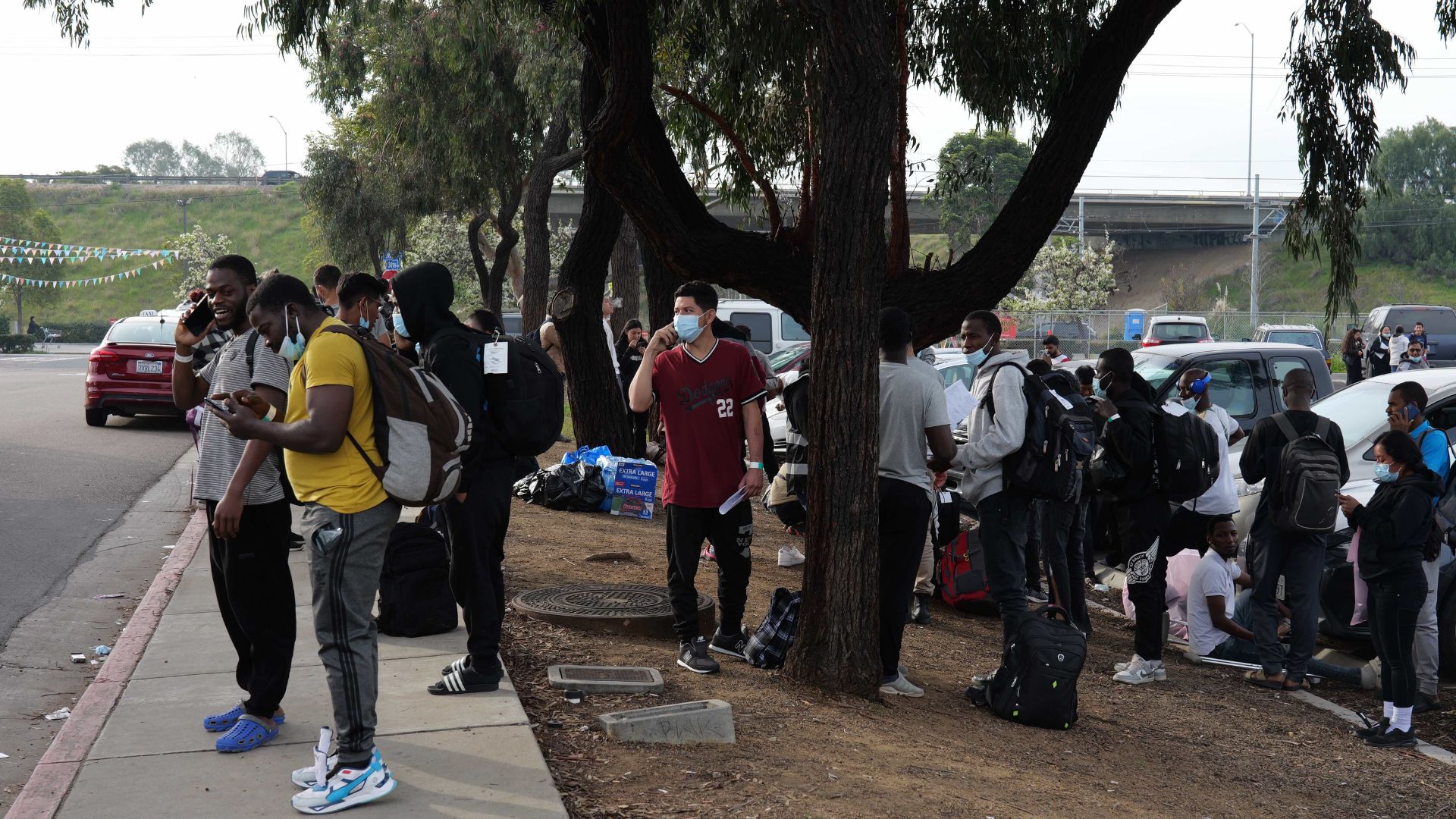 The customers waiting in line to buy guns expressed their concerns about the increasing number of migrants being released in the area